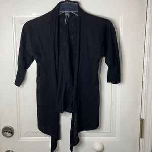 Black little cover up thrown on